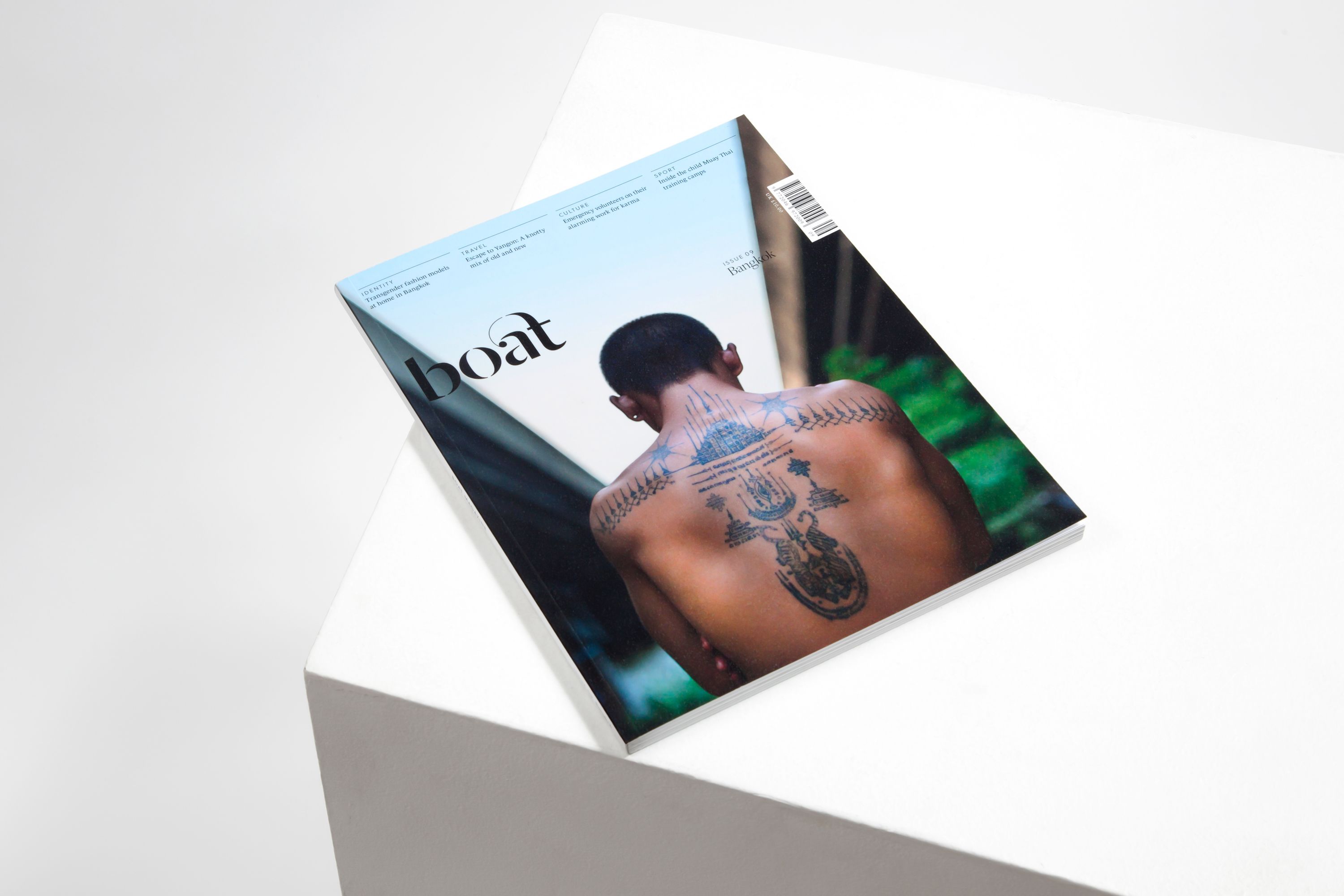 An issue of travel magazine Boat resting at an angle.