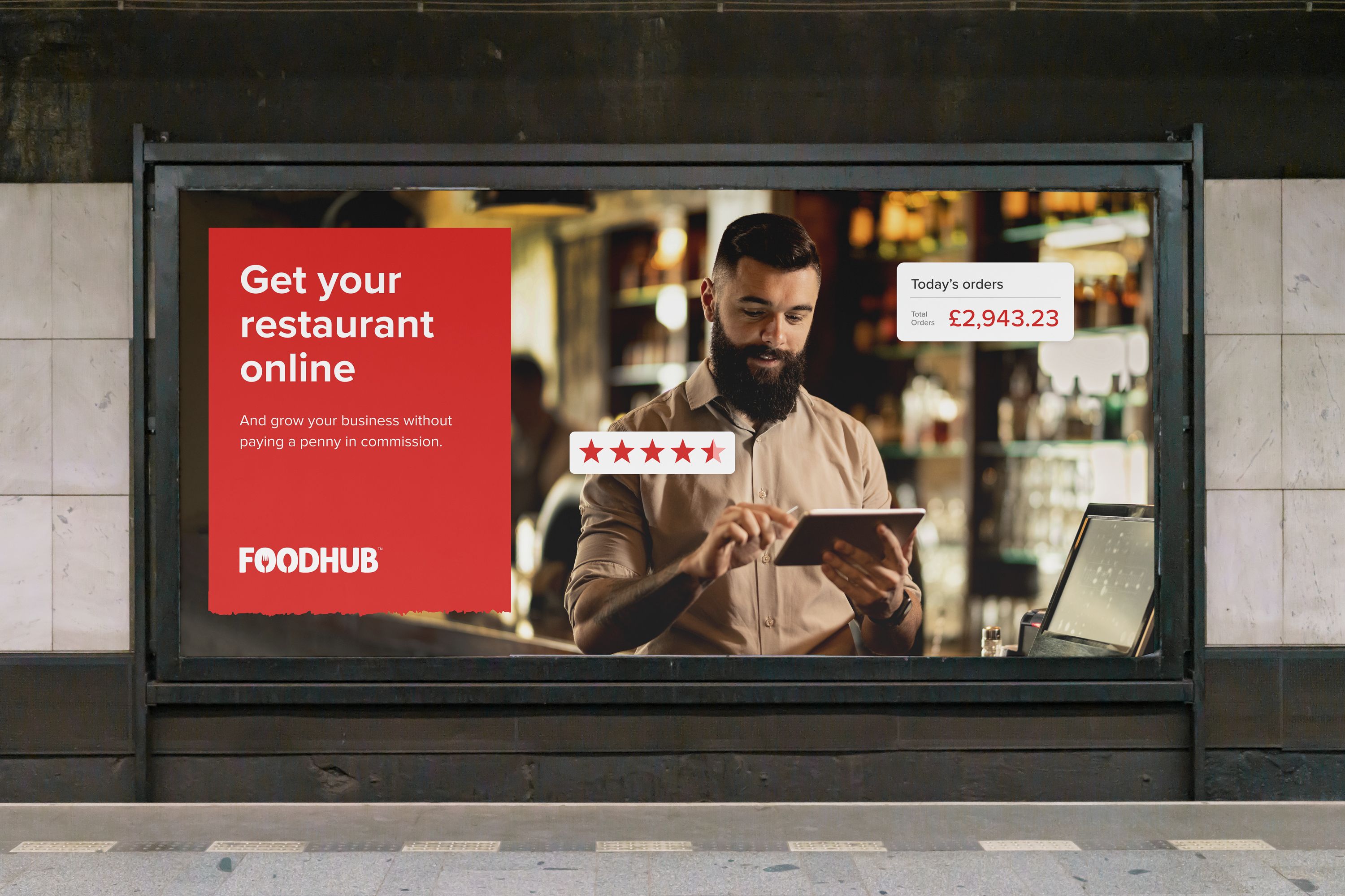 OOH advert for Foodhub, with the title Get your Restaurant online. A restaurant owner can be seen using an iPad.