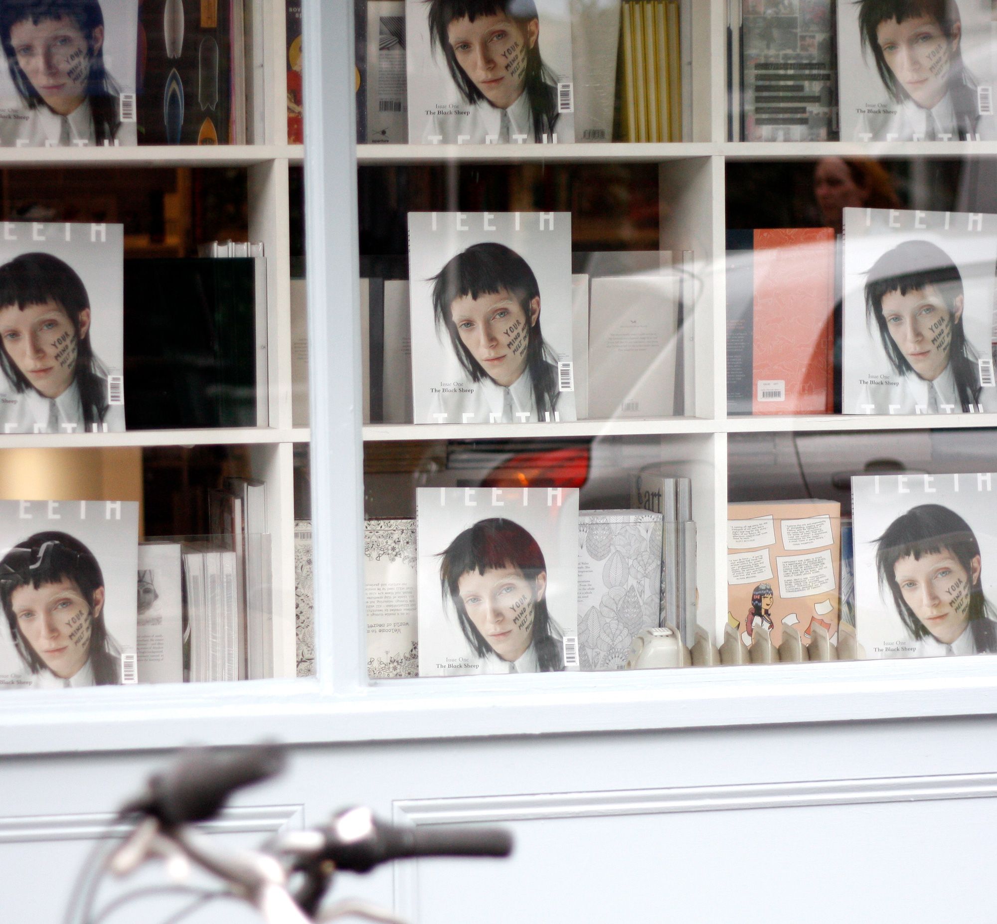 Copies of Teeth magazine in a shop window