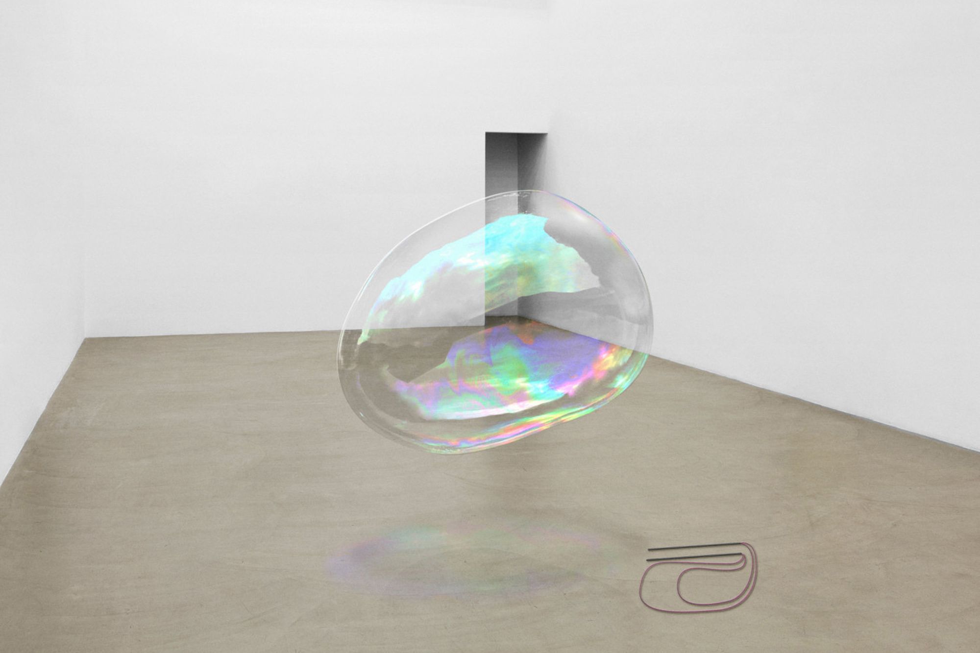 A modern art installation showing what appears to be a floating bubble in a gallery space