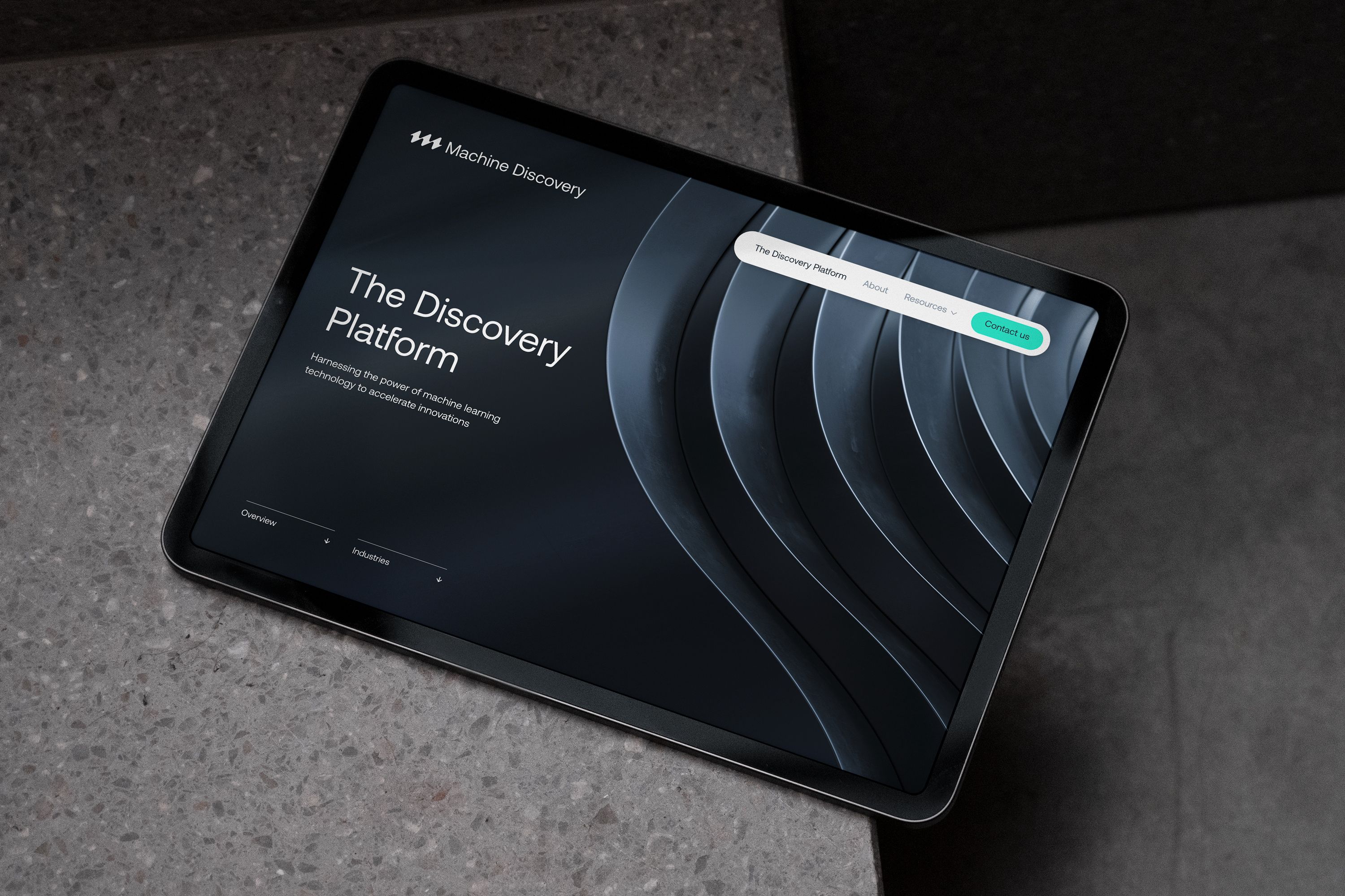 An iPad showcasing the Machine Discovery website.