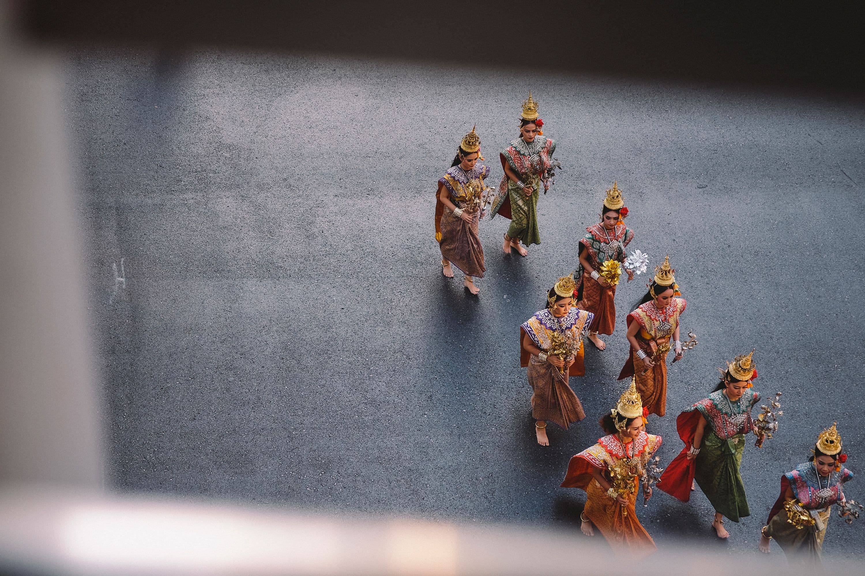 A photography from Boat Magazine. A group of women in vibrant traditional Thai clothing